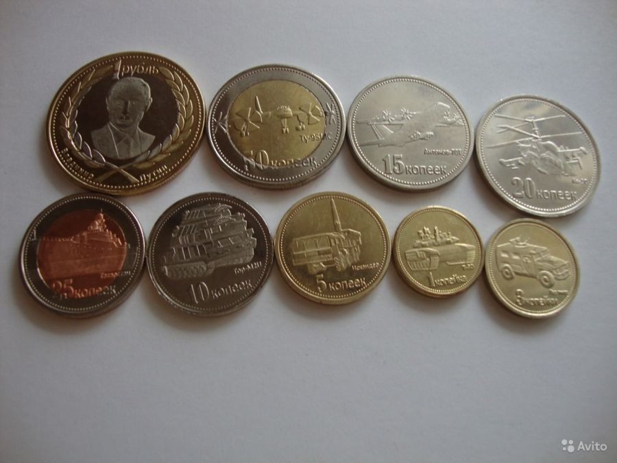 На Украине выпущена монета в одну гривну с изображением Владимира Путина - фото 9